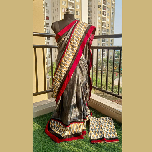 Discover elegance in simplicity with our grey cotton tissue designer saree featuring exquisite ikkat weaving border. Complete with a matching blouse piece, this saree effortlessly blends tradition with contemporary style. - Fabcentra