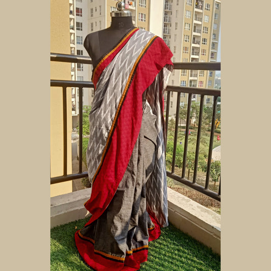 Elevate your style with our Grey & White Ikkat and Half Grey Khadi Cotton Designer Saree. Complete with a matching blouse piece, this stylish ensemble is perfect for the modern woman - Fabcentra