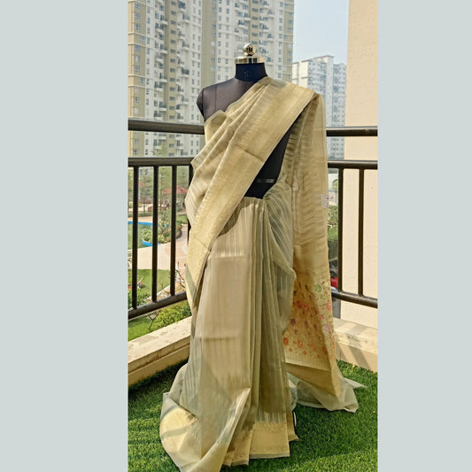 Pastel Grey Saree featuring zari strips border and intricate embroidery on the pallu. Paired with a matching plain pastel grey blouse piece for a cohesive ensemble. - Fabcentra