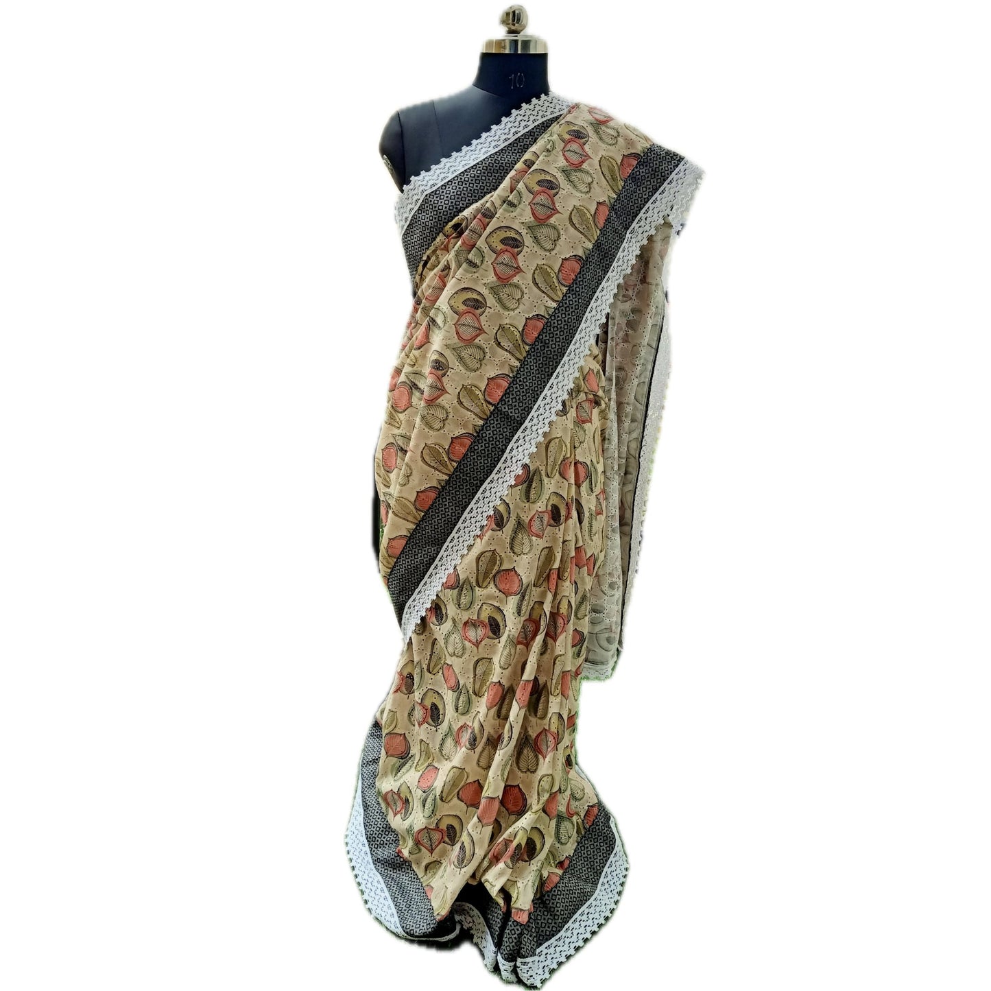 Beige-colored sari, crafted with pure hakoba fabric, featuring intricate detailing throughout the body. Adorned with delicate light ash and black borders, complemented by elegant white lace accents. Complete with a matching blouse piece