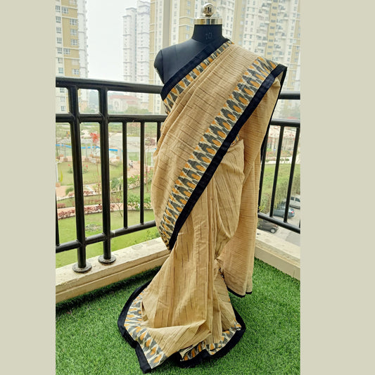 Cotton saree in Tussar colour with all over body weaving with  black piping & ikkat border & blouse piece
