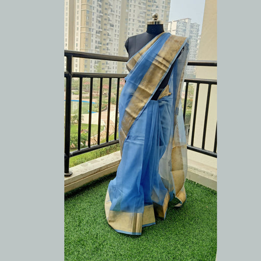 Greyish Blue Organza Saree featuring a zari border and pallu adorned with zari strips. Complete with a matching running blouse piece. - My Store