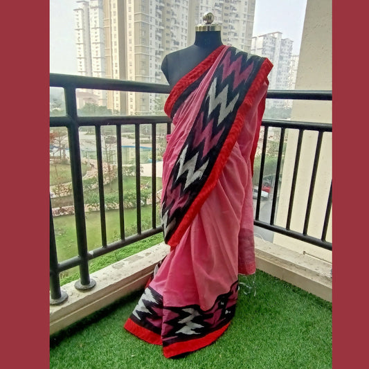 Light Pink Tissue Cotton Saree, a mesmerizing blend of grace and sophistication. Adorned with a stunning pure Ikkat border in shades of rani pink, black, and mauve, this saree exudes an aura of elegance and charm. Paired with a matching blouse piece - My Store